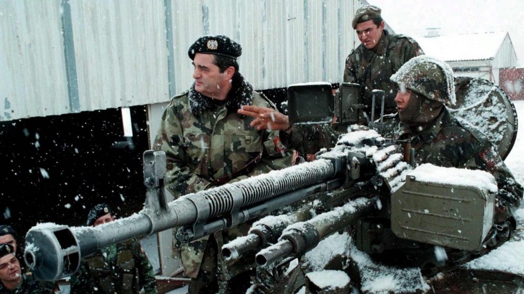 Yugoslav Army commander Nebojsa Pavkovic (left) listens to a soldier’s report near Gjilan/Gnjilane in Kosovo during the war in February 1999. (Photo: EPA/File)